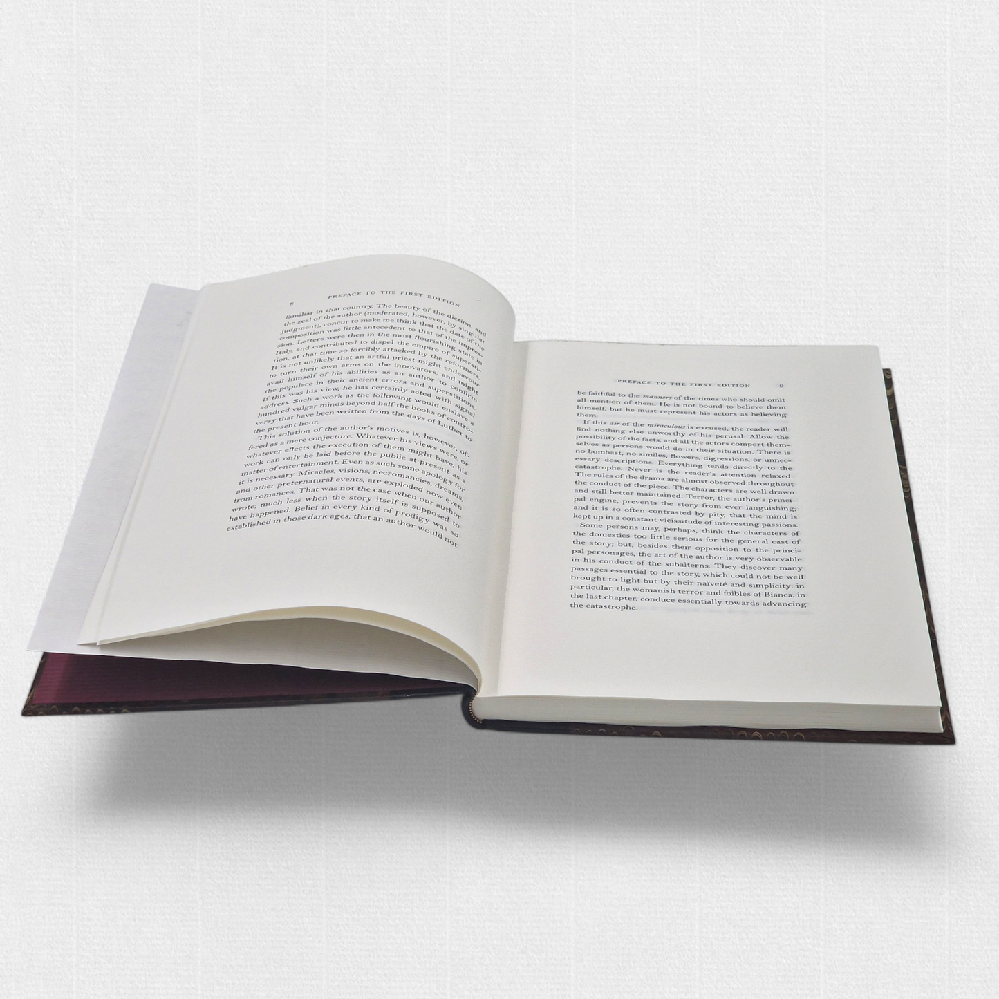 A luxurious 2022 Rambler Press edition of The Castle of Otranto by Horace Walpole, limited to 25 hand-numbered copies. The octavo book, printed on Century Laid cotton paper with watermarks in Monotype Bell typeface, features a half-leather binding with hand-marbled paper sides, gilded edges, and a custom slipcase. The cover evokes the eerie Gothic atmosphere of the 1764 novel, with shadowy castle motifs and intricate detailing, reflecting its status as the cornerstone of the Gothic genre.
